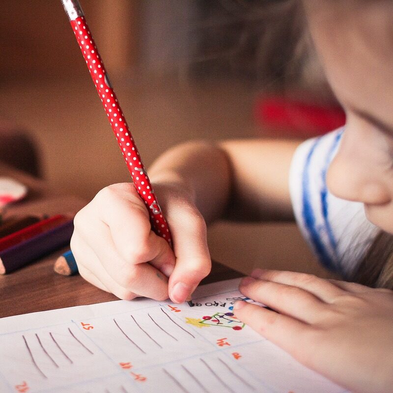 child writing in journal - ooh lovely journals for kids