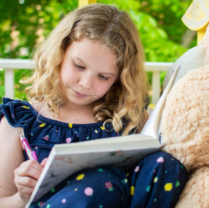 girl writing in journal - ooh lovely journals